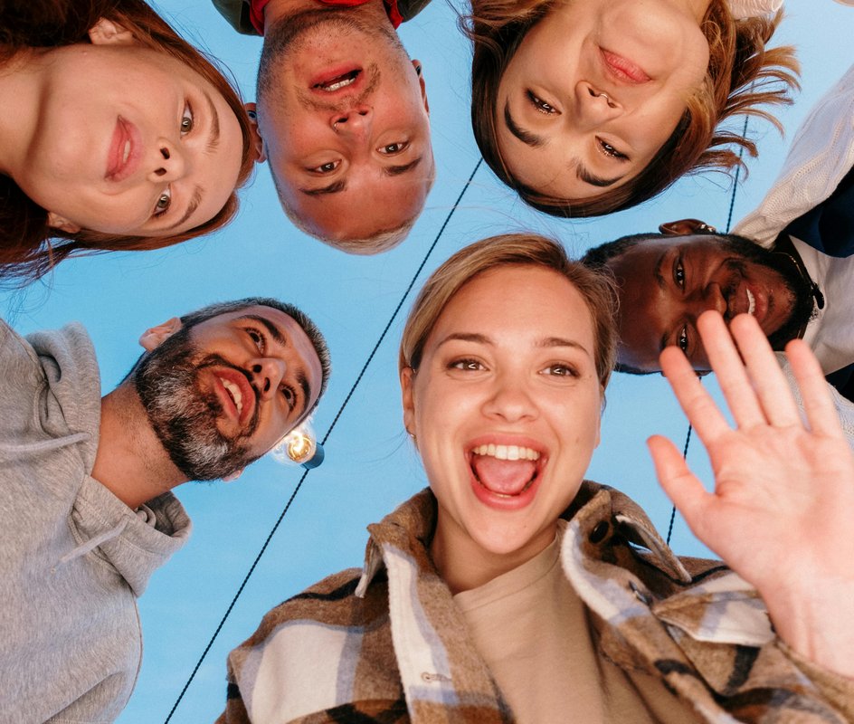 group of people looking intently at a camera